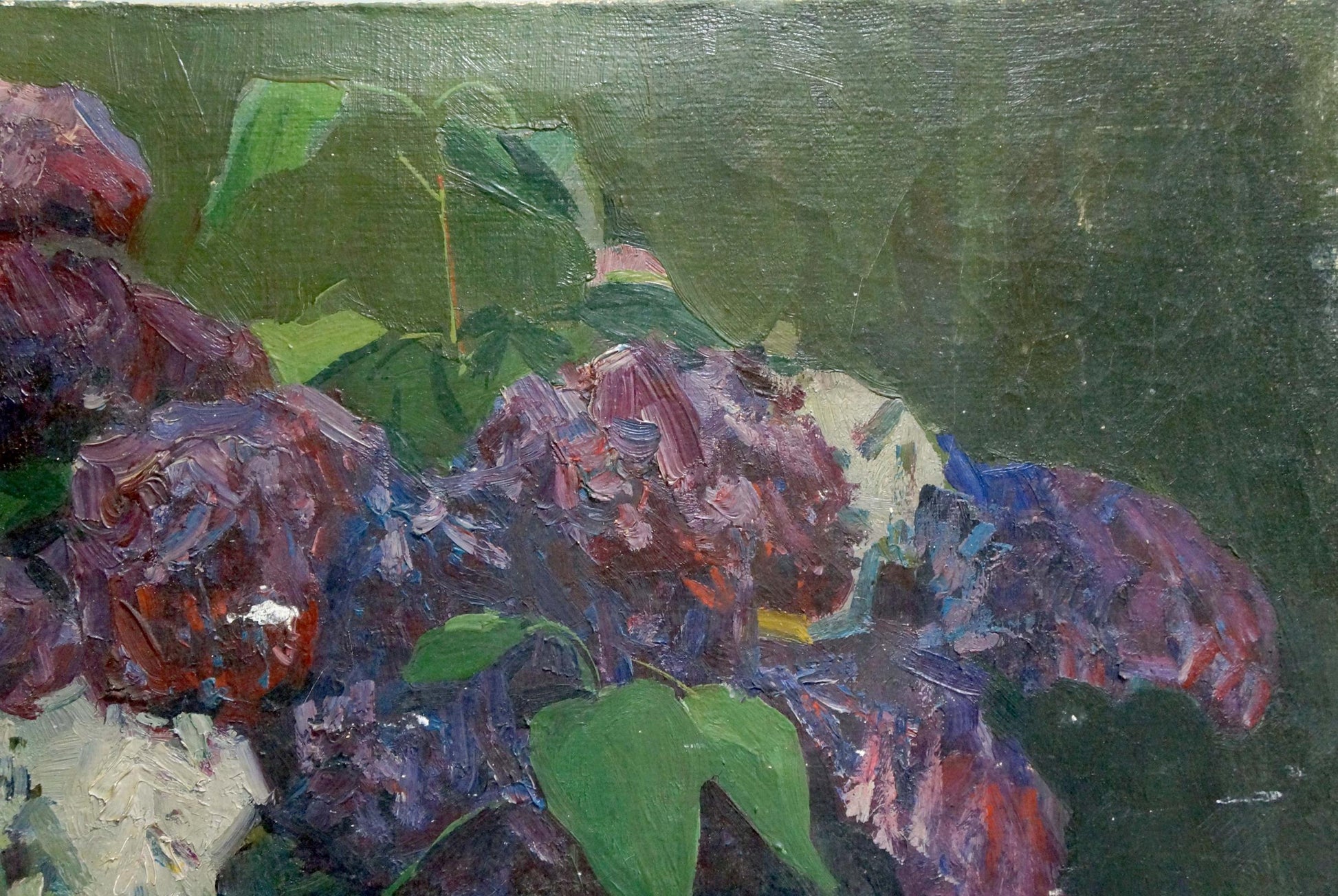 Vibrant oil painting of lilac in a vase with purple blossoms and green leaves