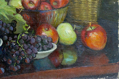 Oil painting of dark purple grapes with green stems in white ceramic dish