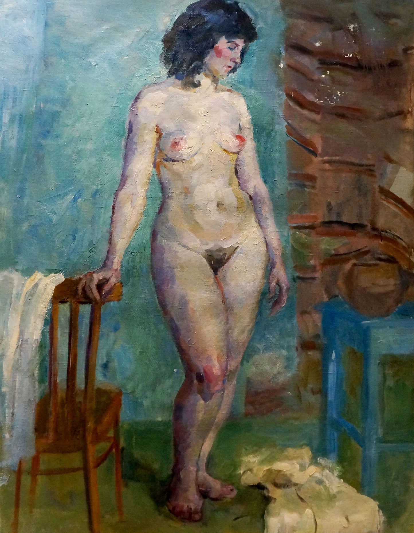 Oil painting of figure Maria Titarenko with dark wavy hair in blue-green room