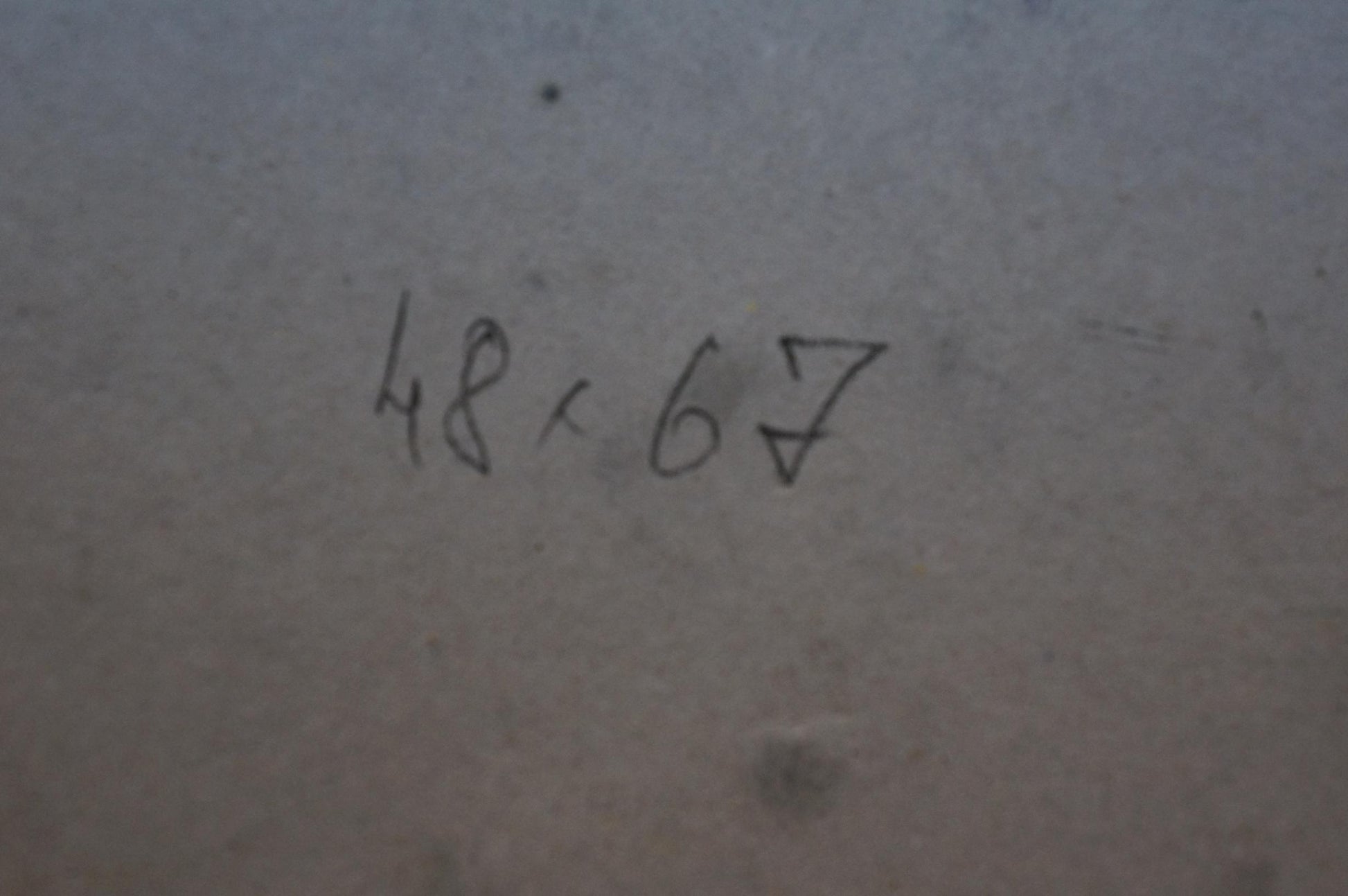 Back of Oil painting Flowers are growing with 48x67 inch handwritten markings on gray surface