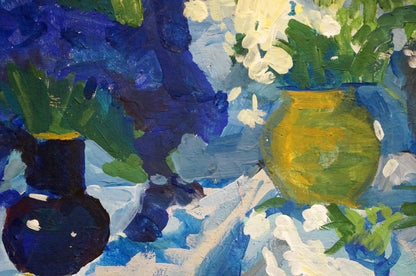 Oil painting of vibrant yellow-green vase with white spring flowers on blue background