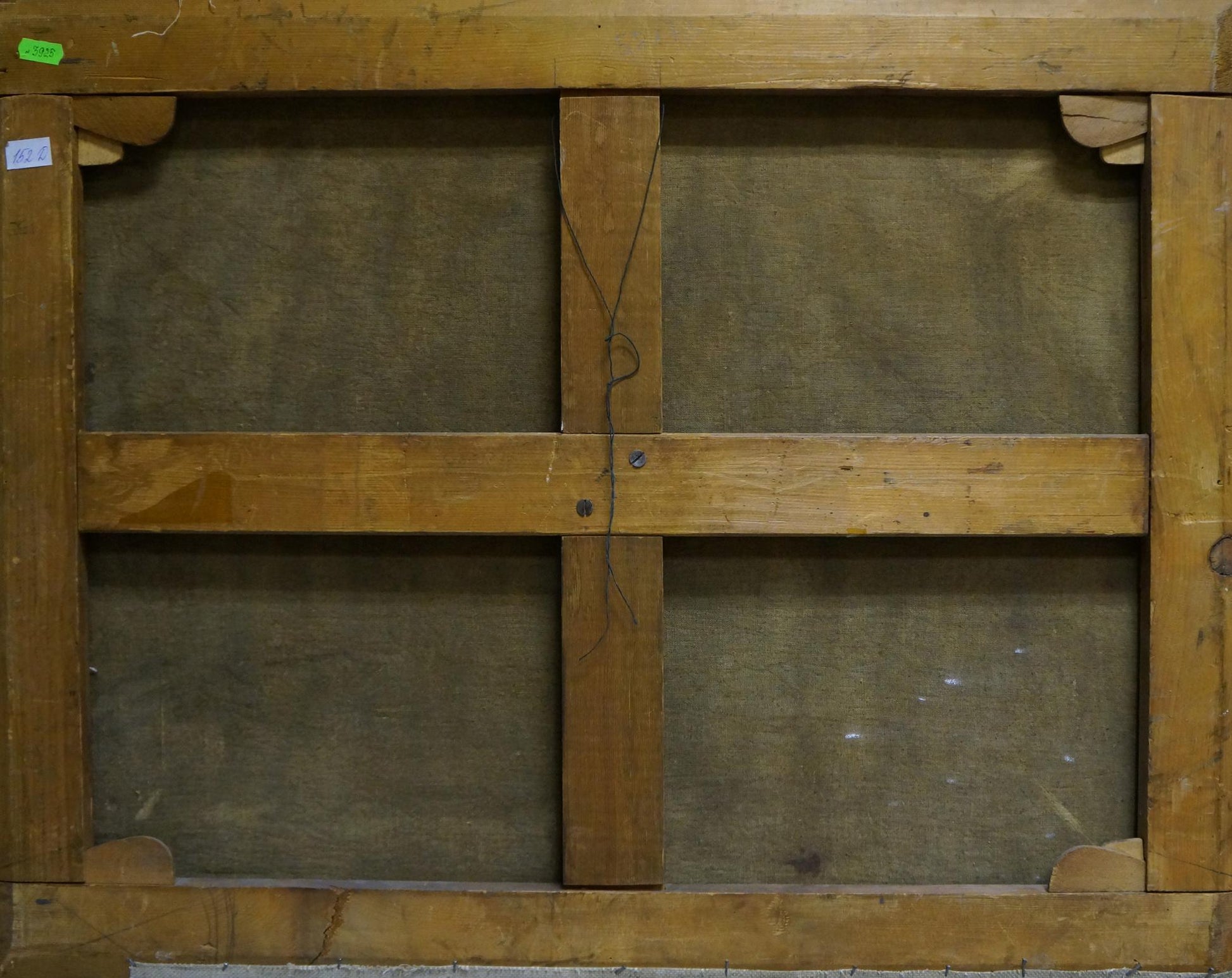 Back of Oil painting Swamp with light brown wooden frame and dark gray canvas panels