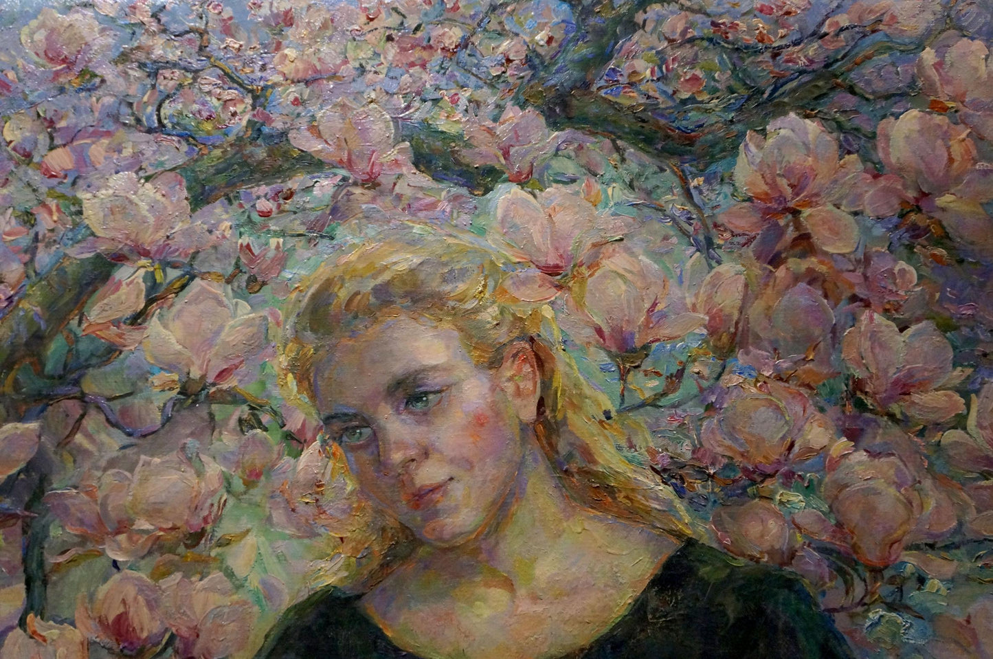 Impressionistic oil painting by Titarenko Maria Anatolyevna: blonde woman in dark top among pink magnolias