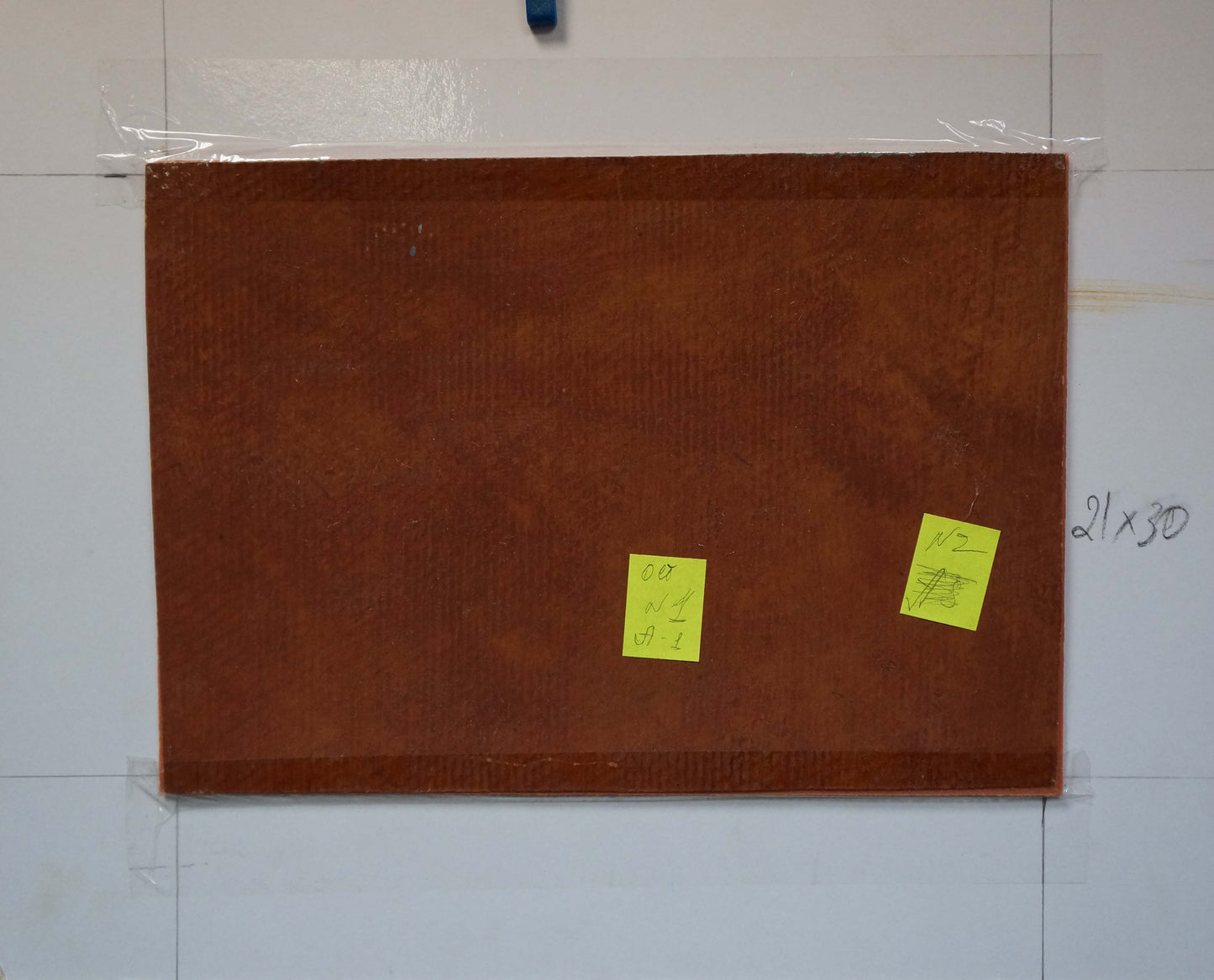 Brown textured rectangular board on back of Oil painting The train has started