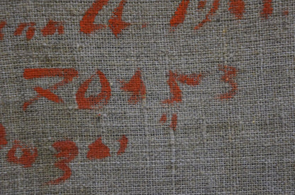 Back of Artur Sarkisyan Red Roses oil painting: gray woven fabric with faded red markings