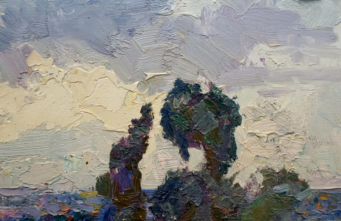 Impasto textured painting of two dark green and purple trees against a pale sky.
