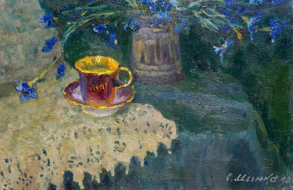 Oil painting of golden-rimmed teacup on saucer by Mynka on embroidered cloth