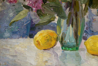 Oil painting of lilacs and tulips on table with yellow lemon and green vase
