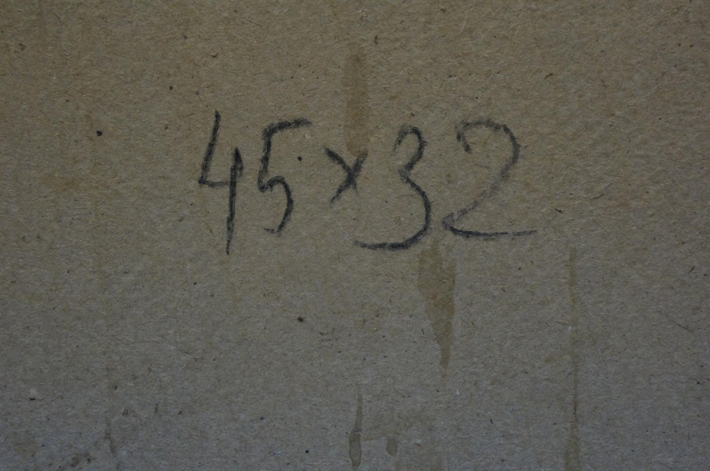 Black chalk markings of mothers portrait on textured concrete wall