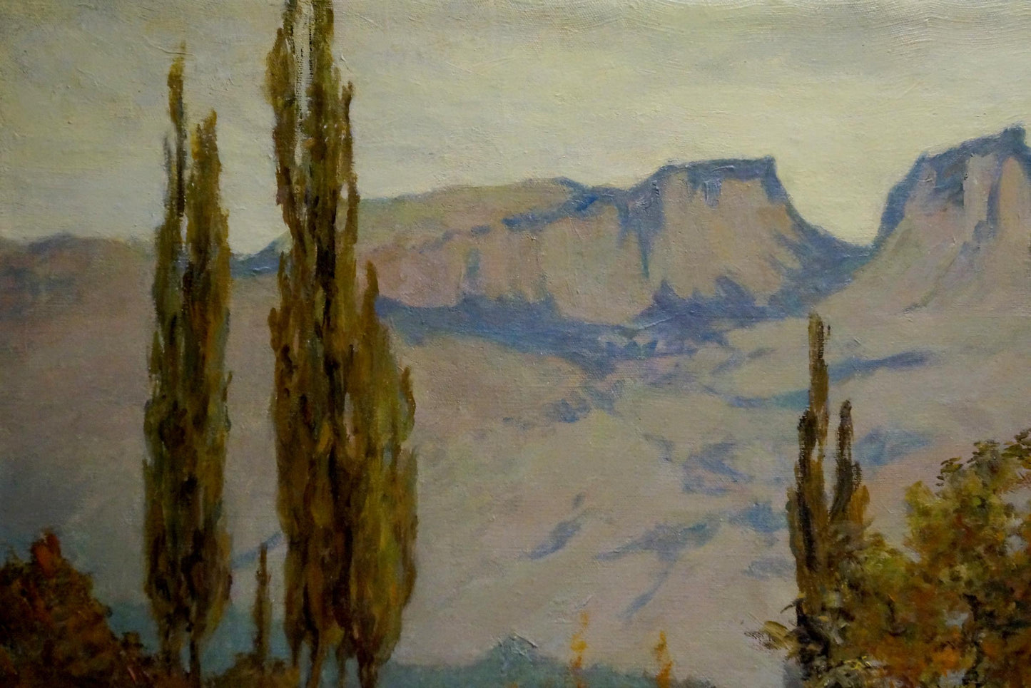 Serene Ferber A oil painting of cypress trees and mountains