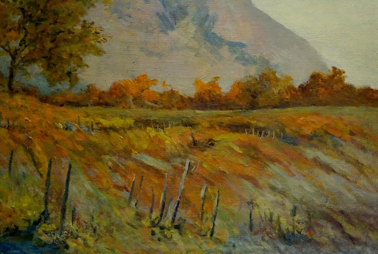 Oil painting of autumnal mountain landscape field by Ferber A with textured brushstrokes in warm ochre, gold, and muted green tones