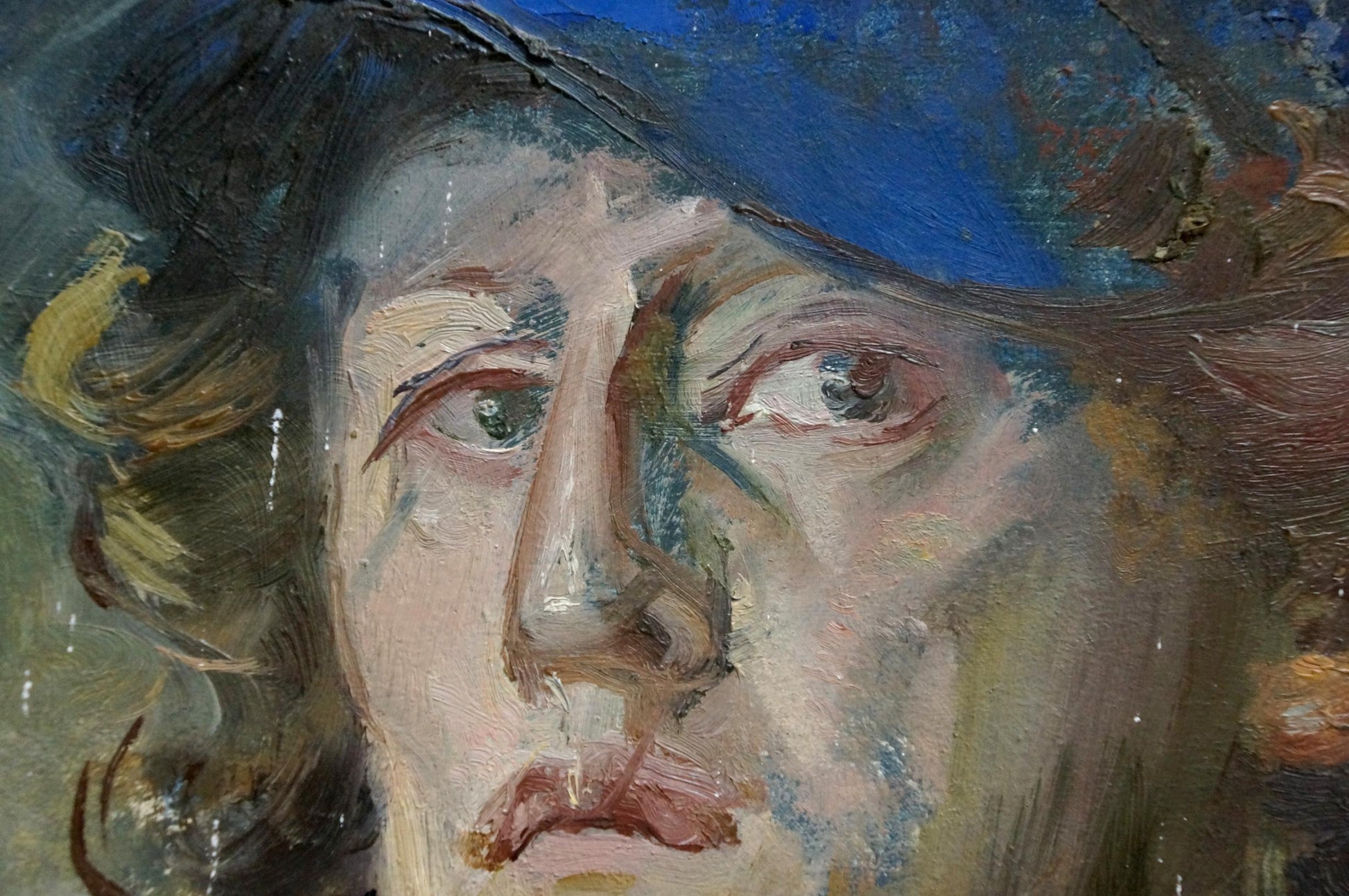 Textured oil painting portrait of the artist with expressive eyes