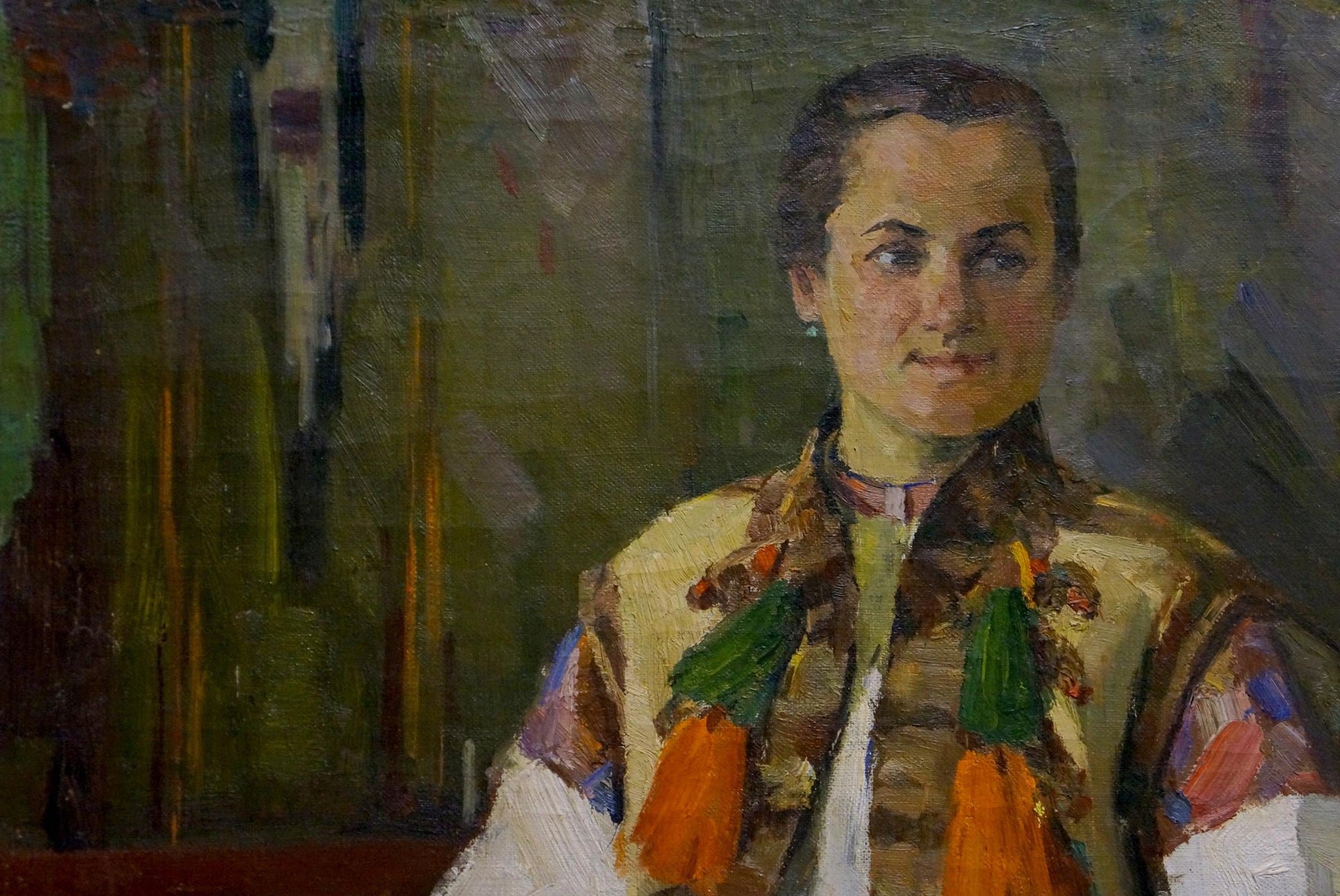 Oil painting portrait of mom in colorful patterned vest with orange tassels