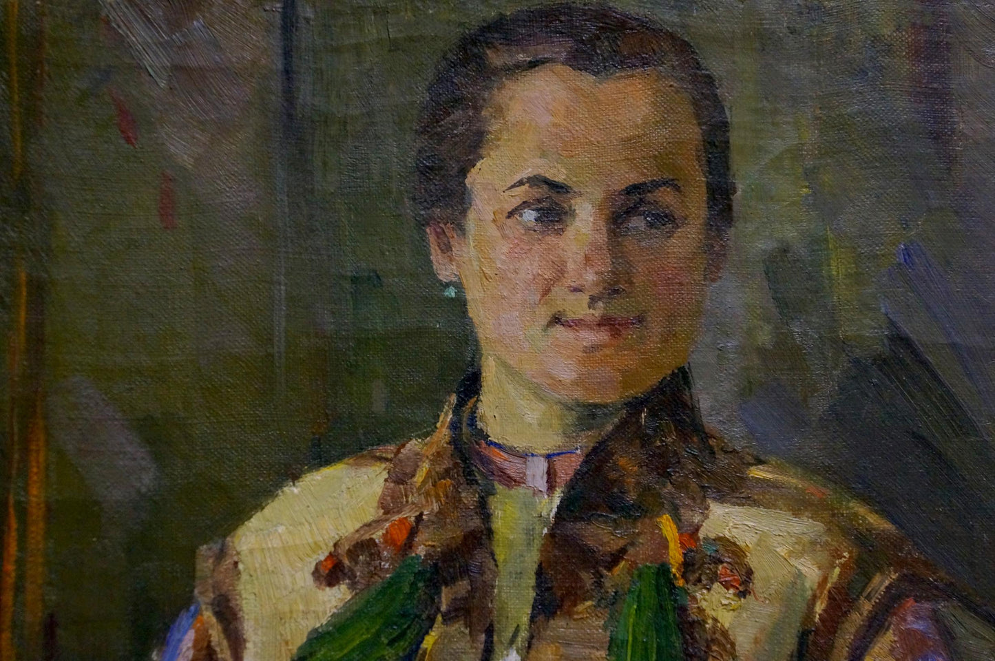 Oil painting portrait of mom with dark hair, earrings, earthy patterned garment