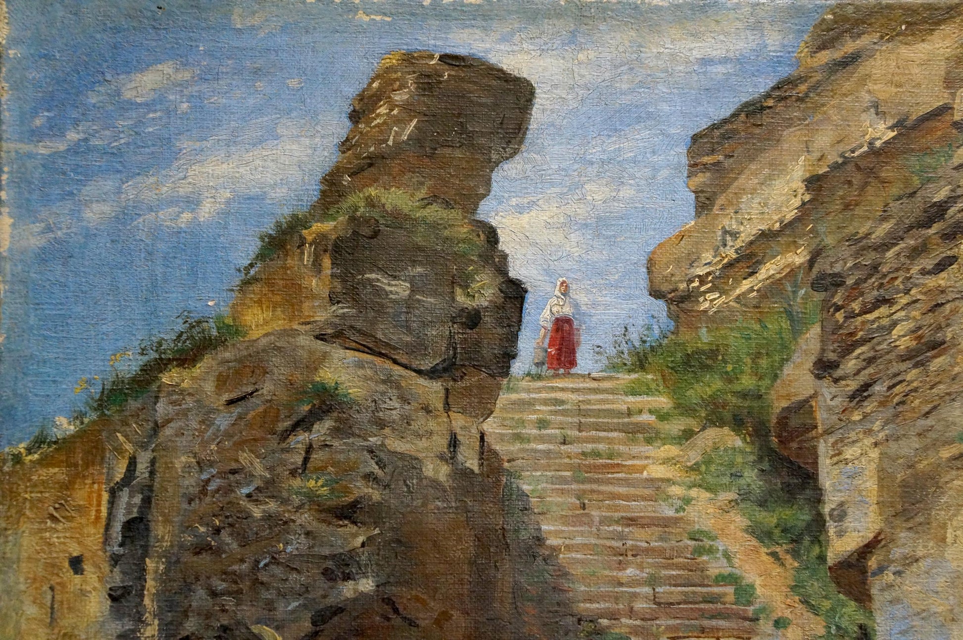 Oil painting of woman in red skirt atop stone steps amid ancient rock formations