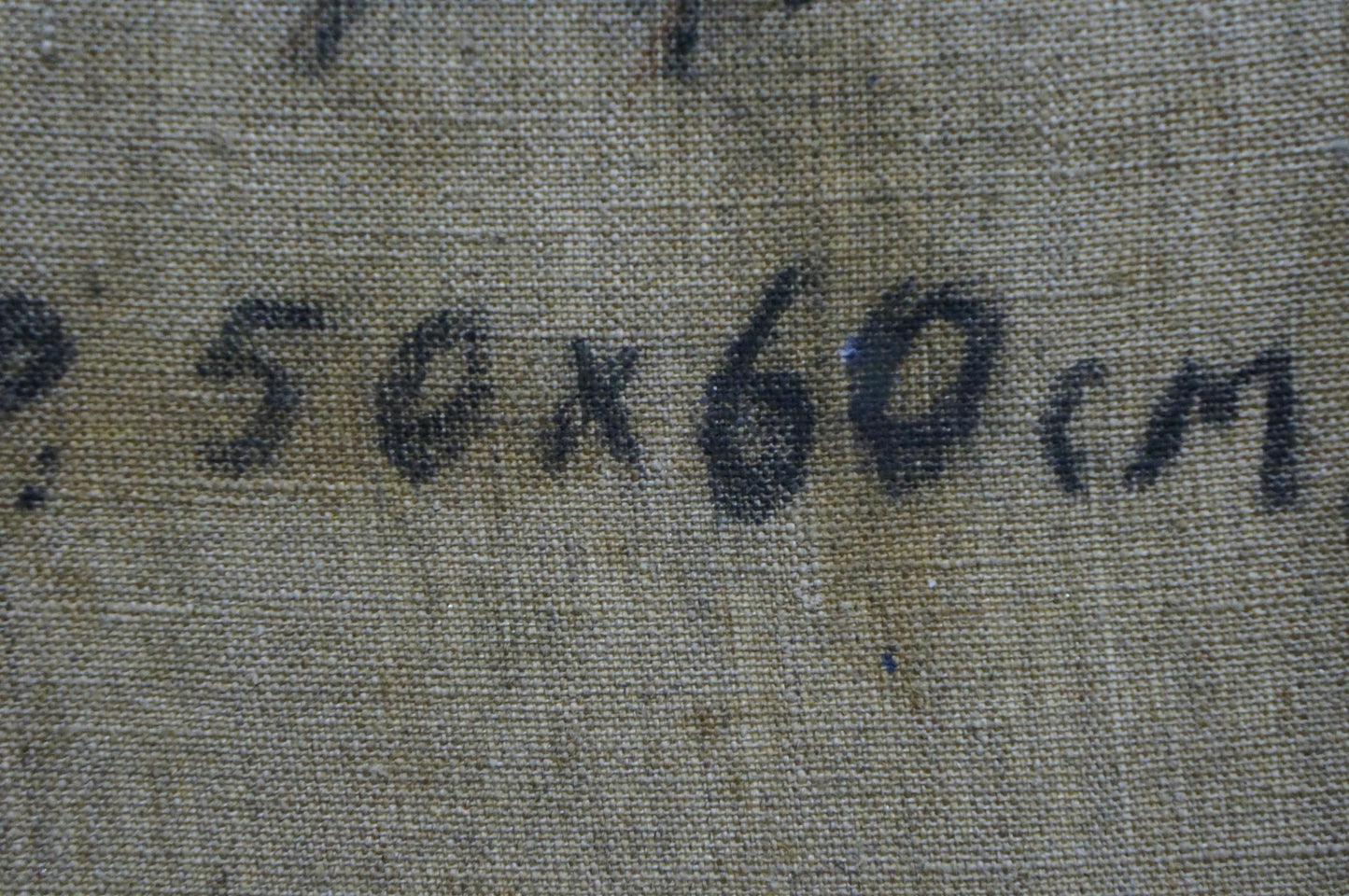 Back of Alexander Mynka oil painting with faded handwritten text on fabric