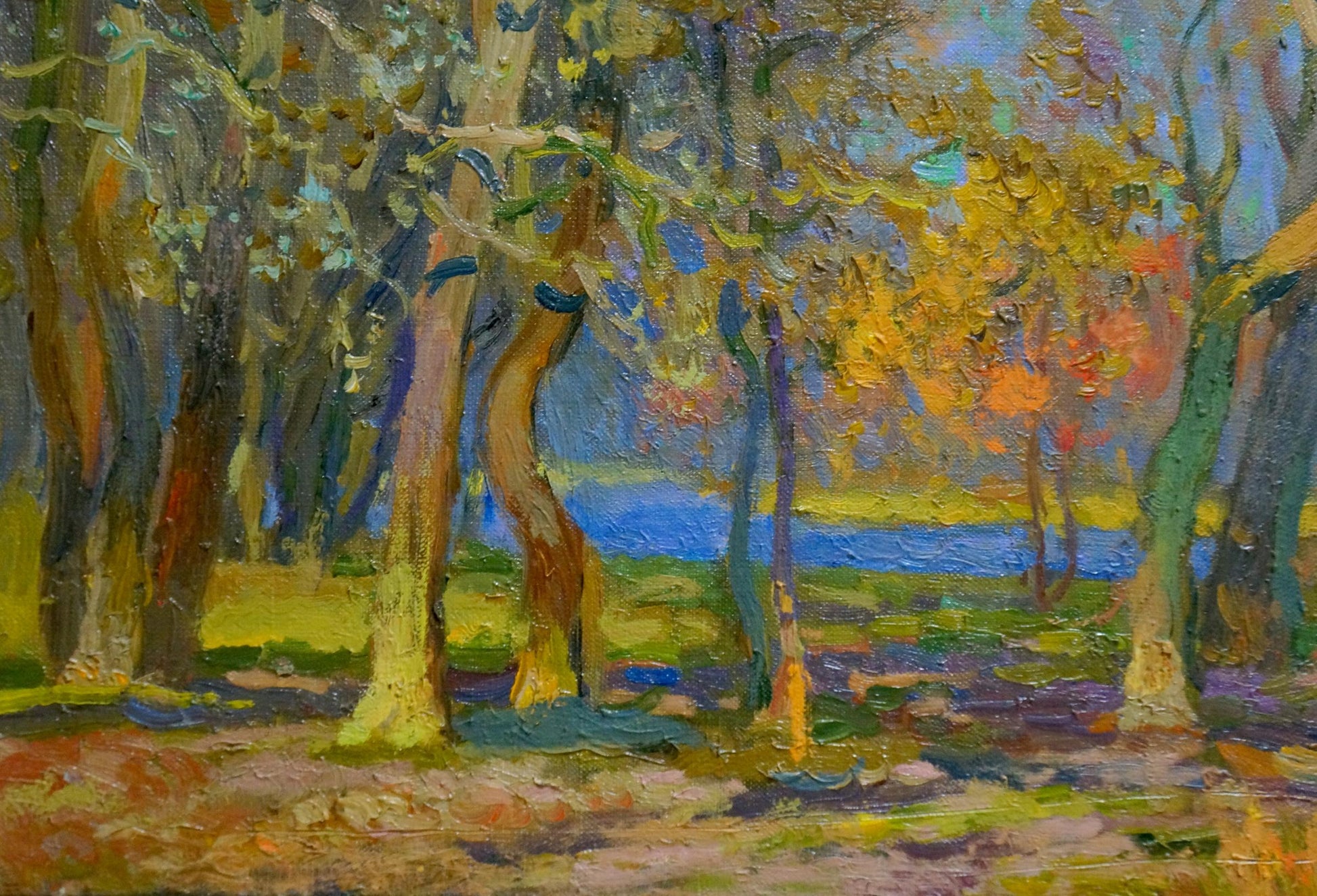 Impressionistic oil painting by Mynka Alexander Fedorovich: gold autumn forest by blue waterway