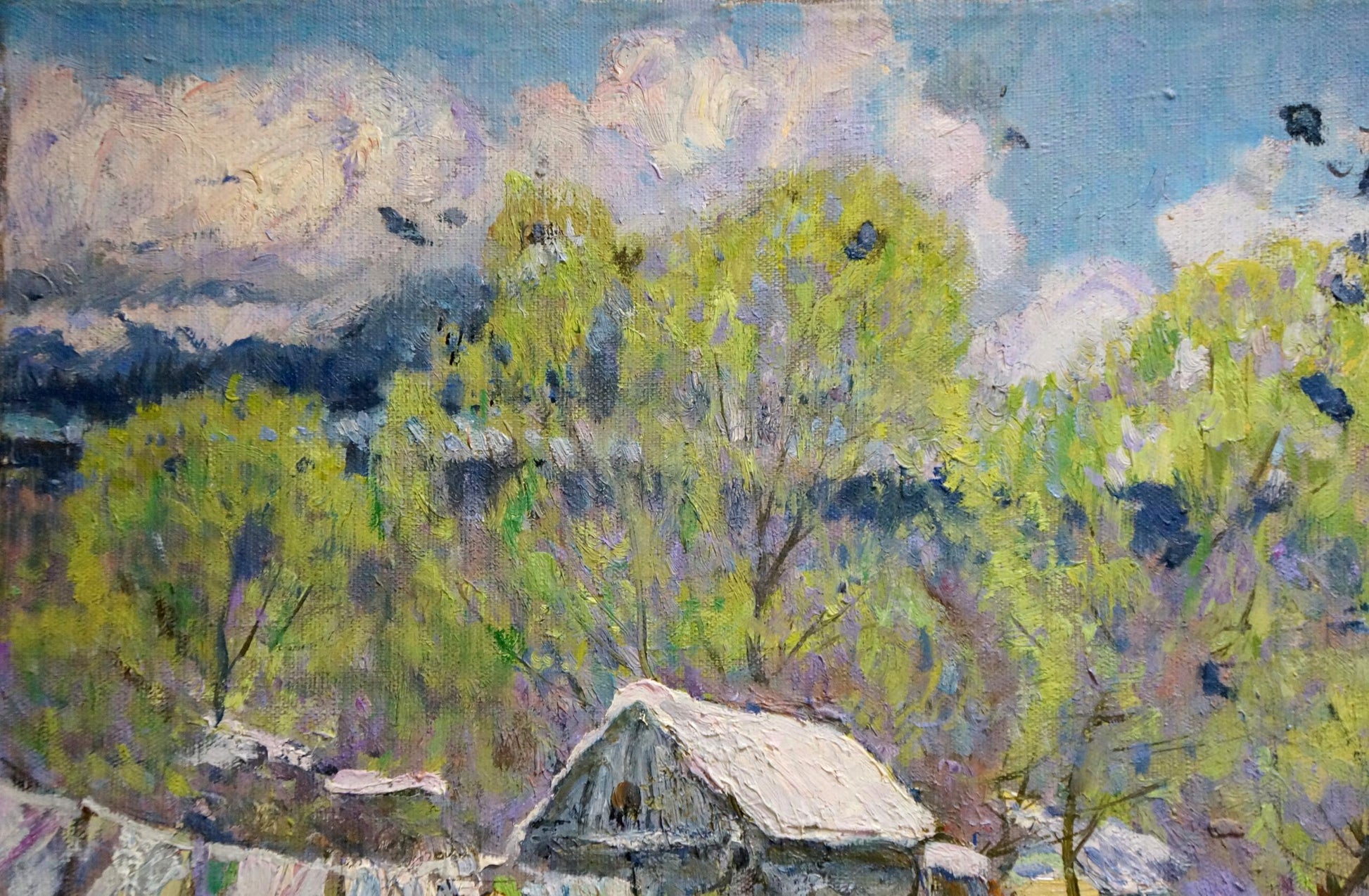 Oil painting End of Winter by Zvyagintsev Rostislav Mikhailovich: rustic wooden house with snow-dusted roof among green trees under cloudy sky