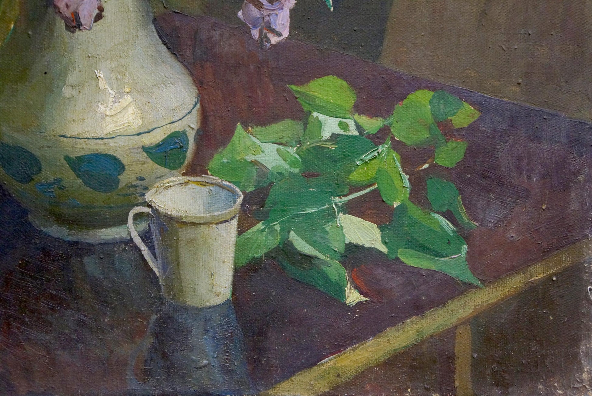 Oil painting of cream ceramic pitcher and cup with blue leaves, lilac and book