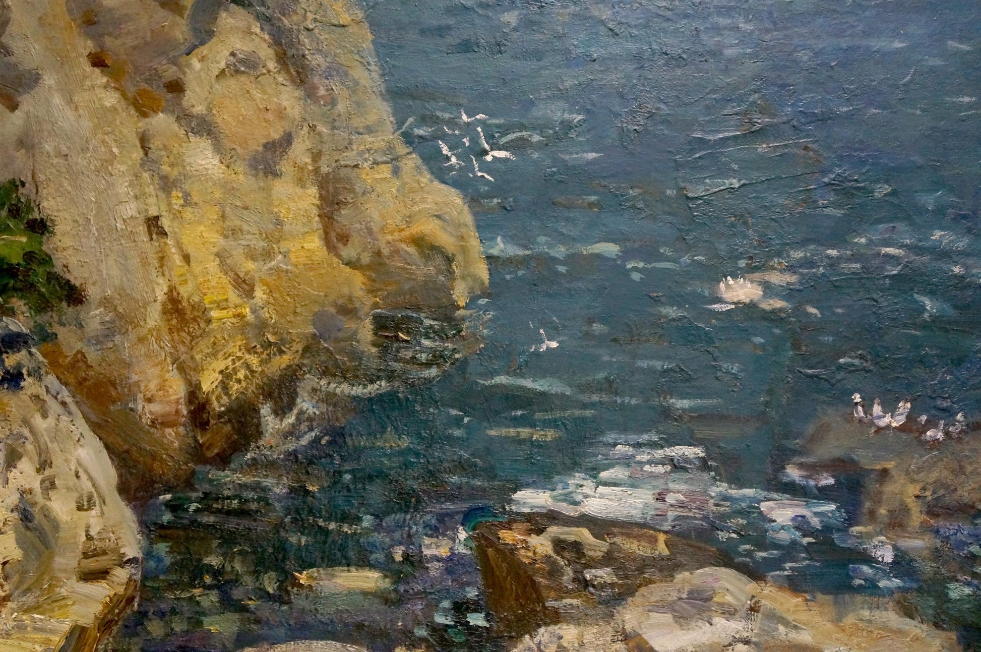 Oil painting by Merinov Alexey Iosifovich: textured ochre cliffs meet blue ocean waves with seabirds