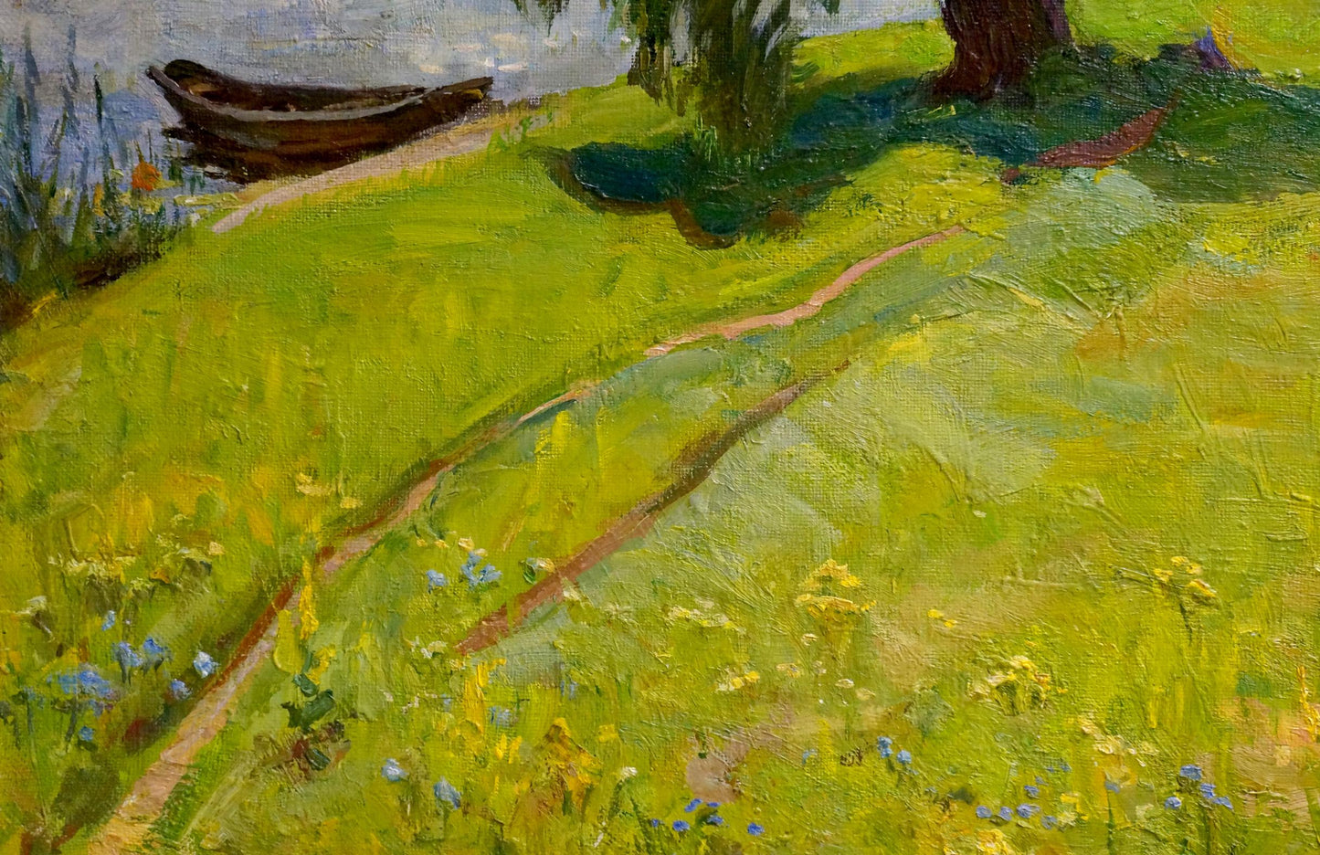 Oil painting by Yuri Petrovich Basanets: rustic rowboat on grassy bank by calm water