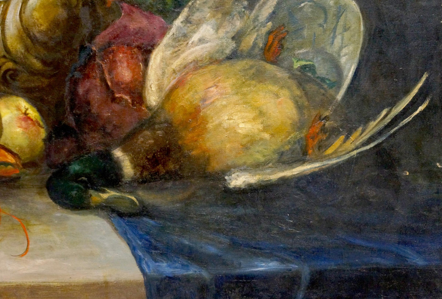 Oil painting of still life feast with green-headed duck on blue cloth