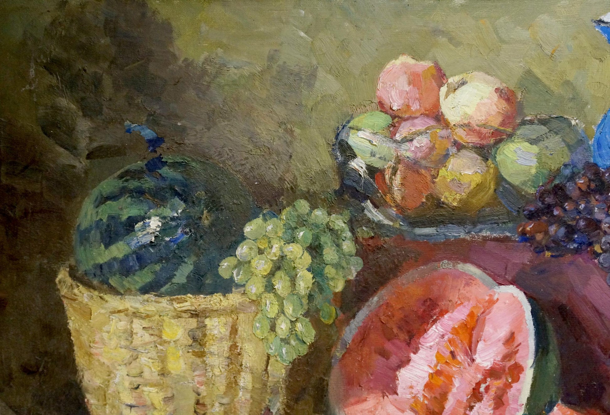 Oil painting by Alexander Kerzhner: wicker basket with striped watermelon and grapes