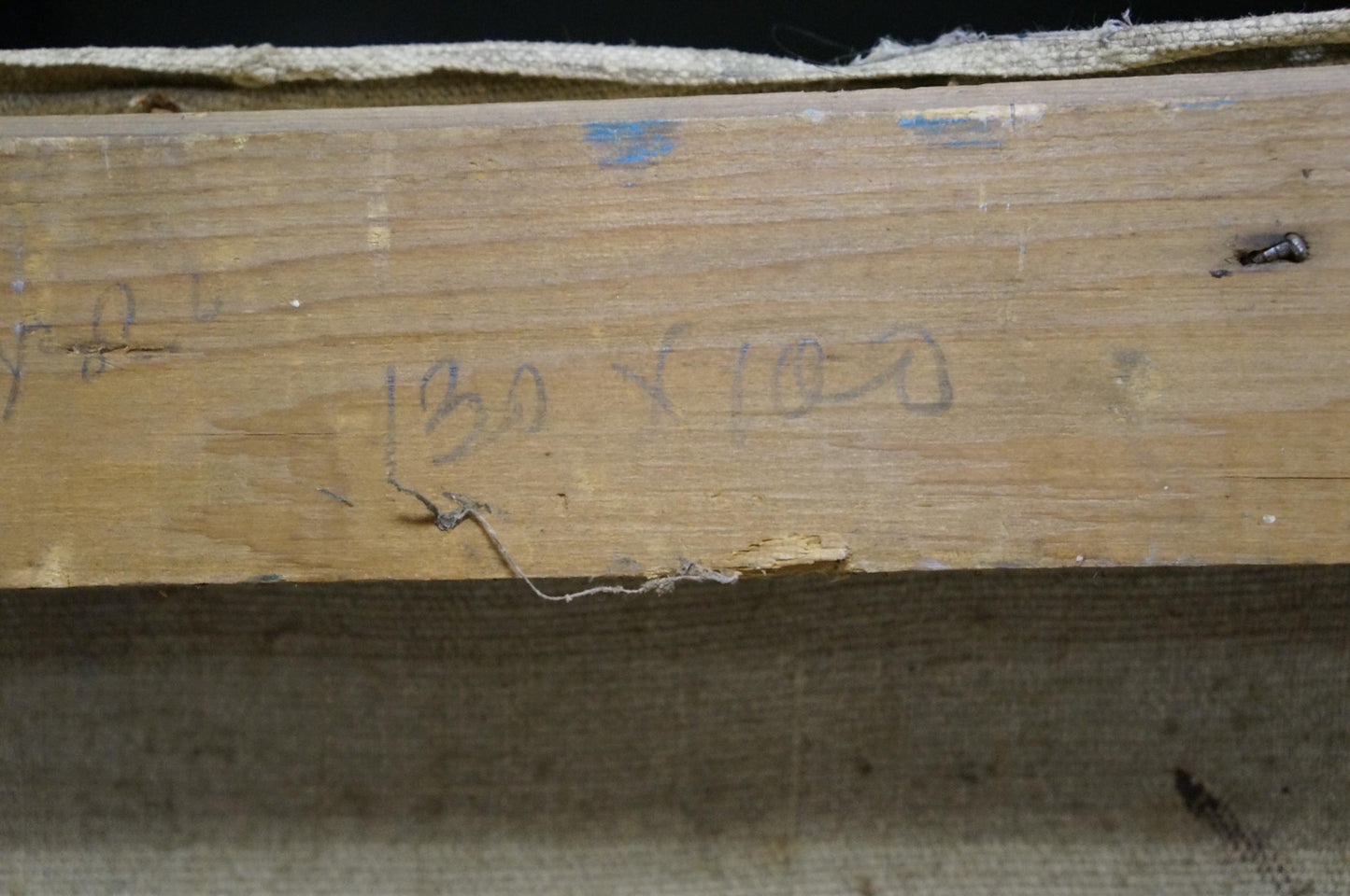 Back of Alexander Kerzhner oil painting with worn wooden plank and faded grain