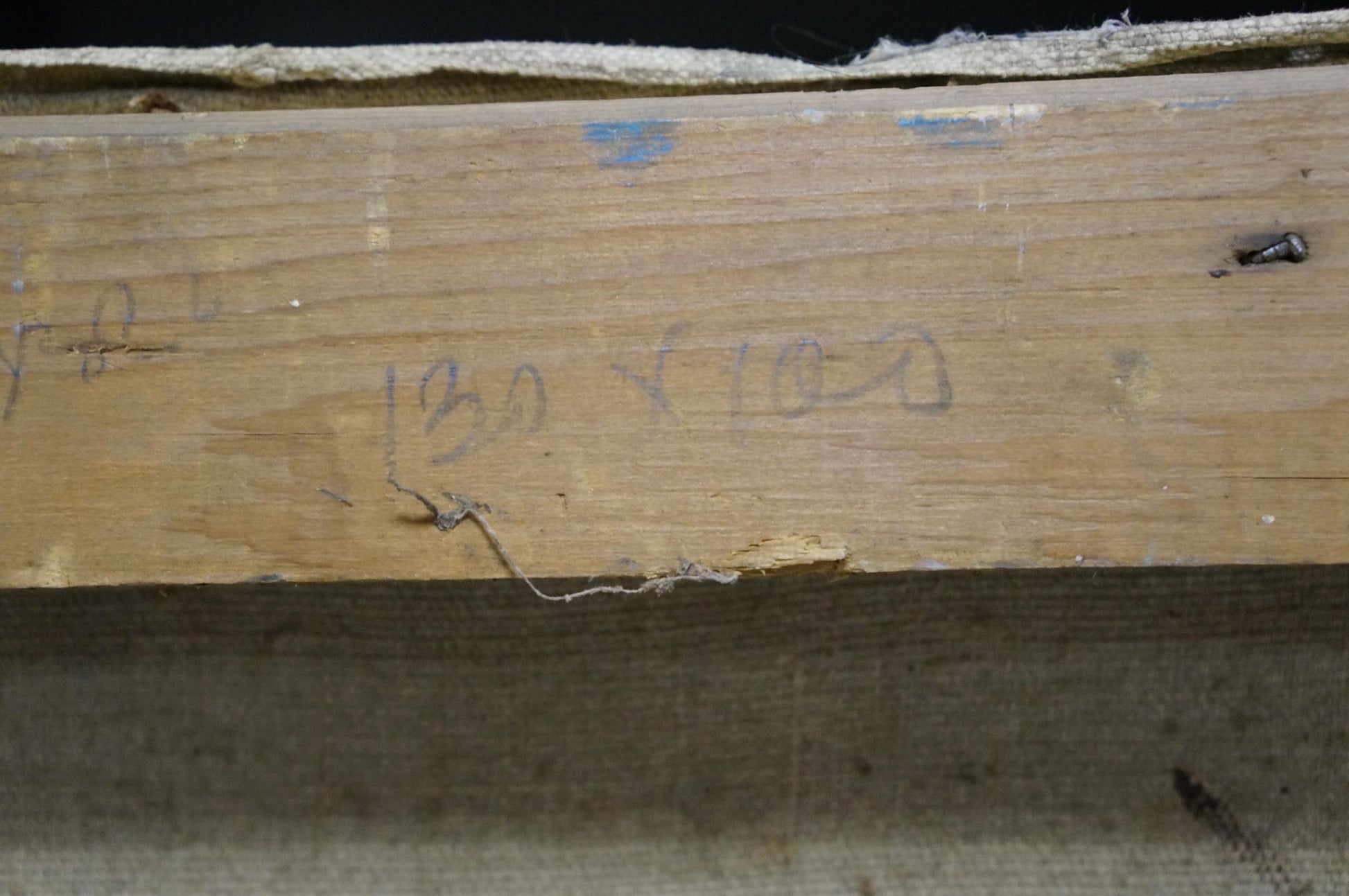 Back of Alexander Kerzhner oil painting with worn wooden plank and faded grain
