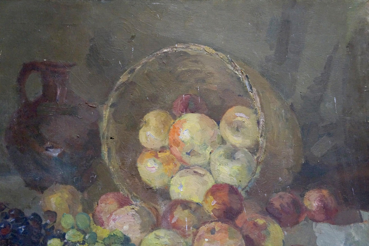 Oil painting of rustic basket with yellow, green, red apples by Alexander Kerzhner