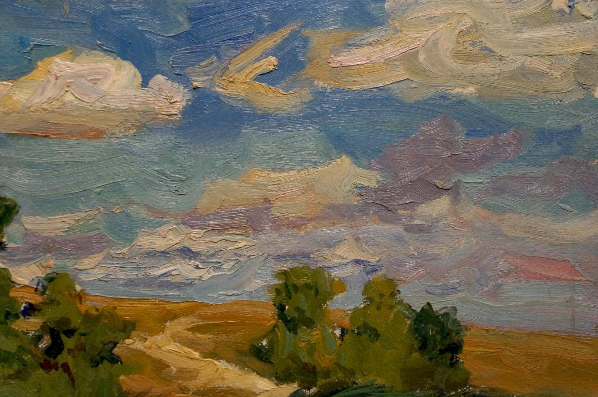 Oil painting by Kolosovsky Georgy Sergeevich: swirling blue clouds over green trees, golden earth, river