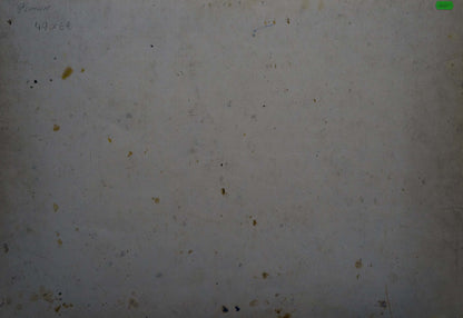 A weathered off-white surface with scattered dark and yellowish stains.