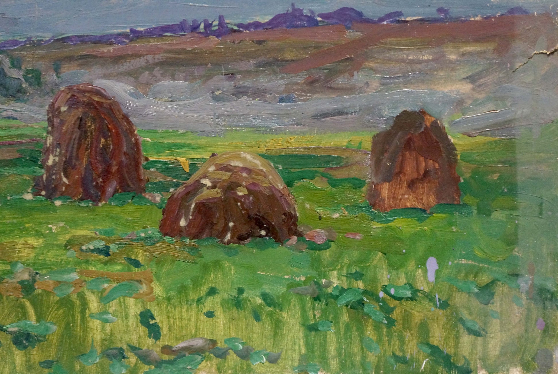 Oil painting Sunset by Fomin Anatoly Nikiforovich: hay bales in green field