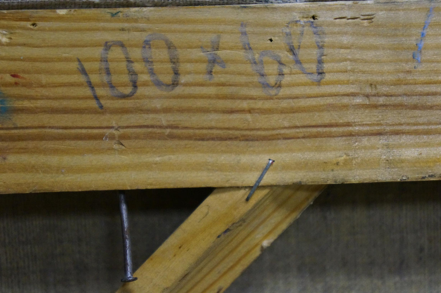 Back of Vladimir Schwab Night Roses oil painting on weathered wooden beam