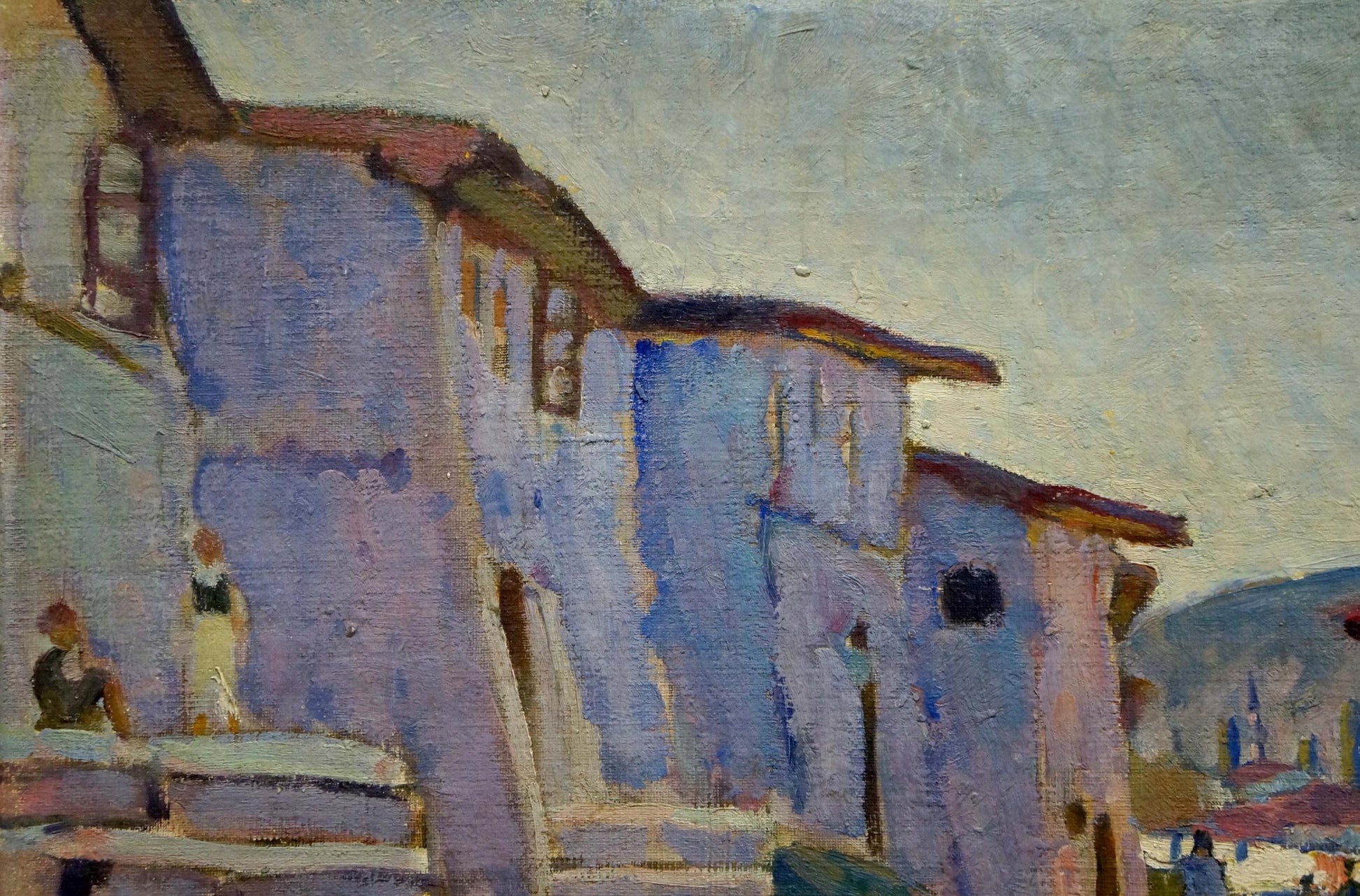 Oil painting The streets of the city: textured blue purple building with red-brown roof under pale sky