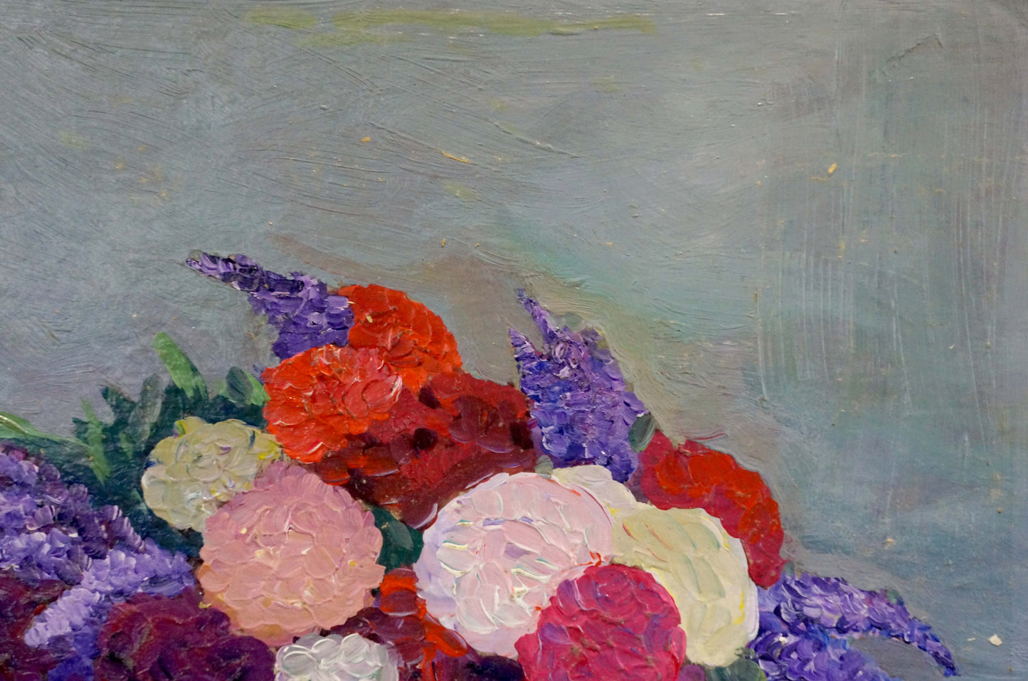 Oil painting of vibrant sweet still life flowers in reds, pinks, purples, whites