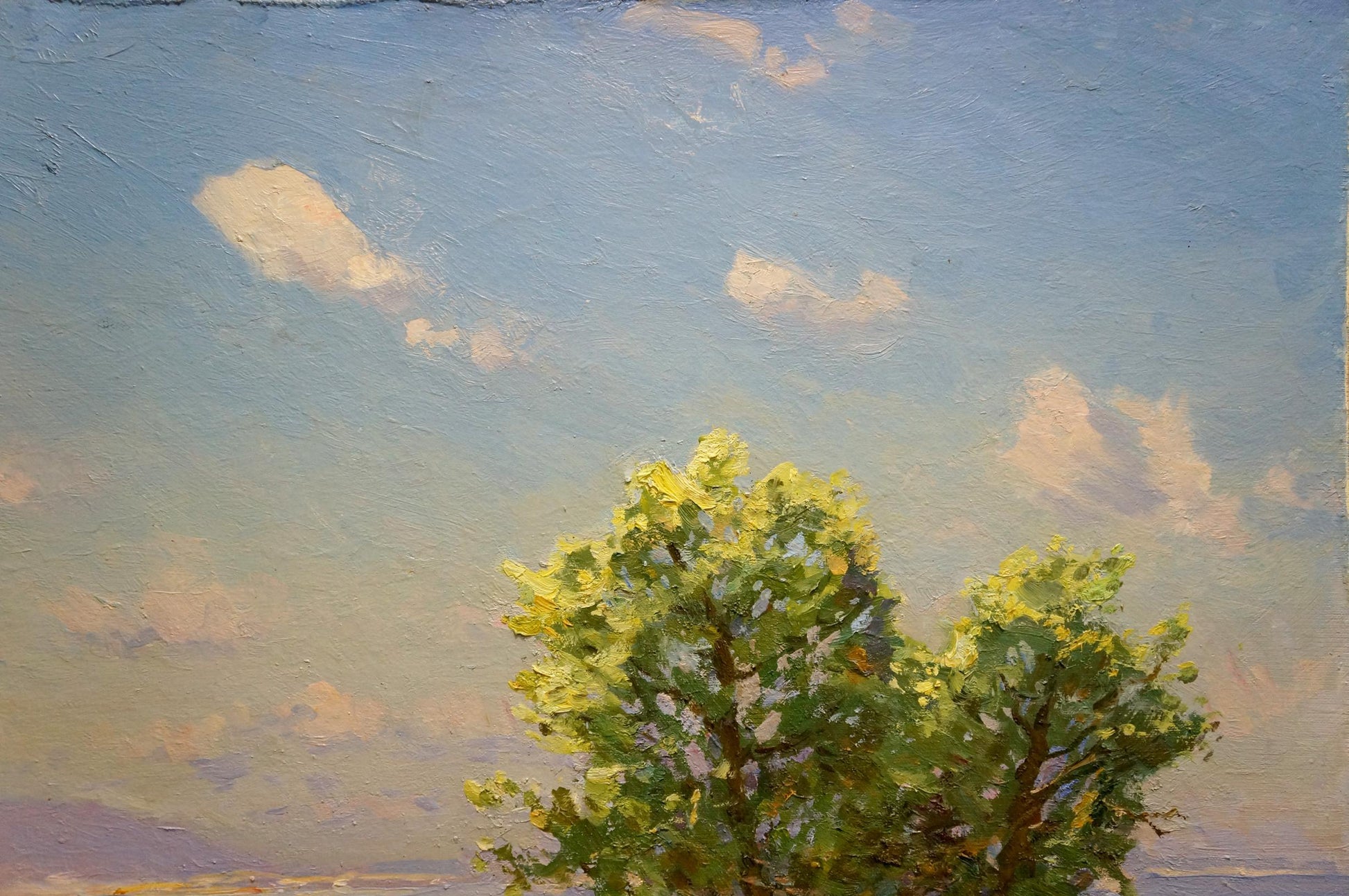 Oil painting by Khodchenko Lev Pavlovich: vibrant green tree, blue sky, clouds