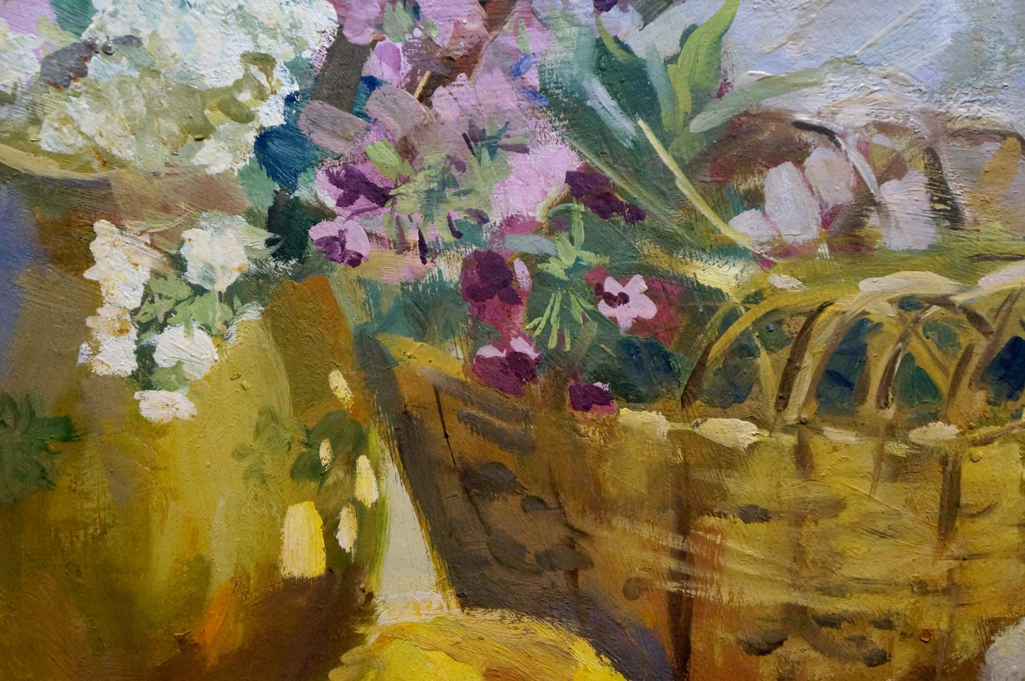 Oil painting of woven yellow basket with vibrant white purple pink flowers