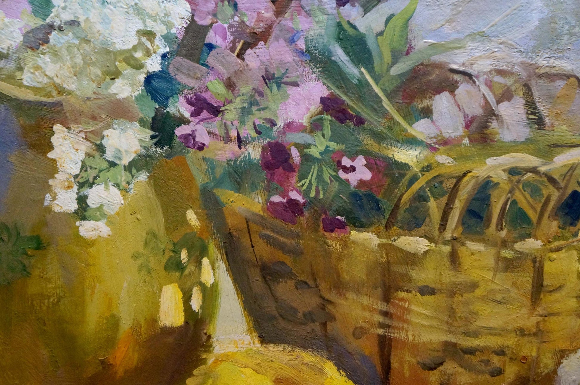 Oil painting of woven yellow basket with vibrant white purple pink flowers