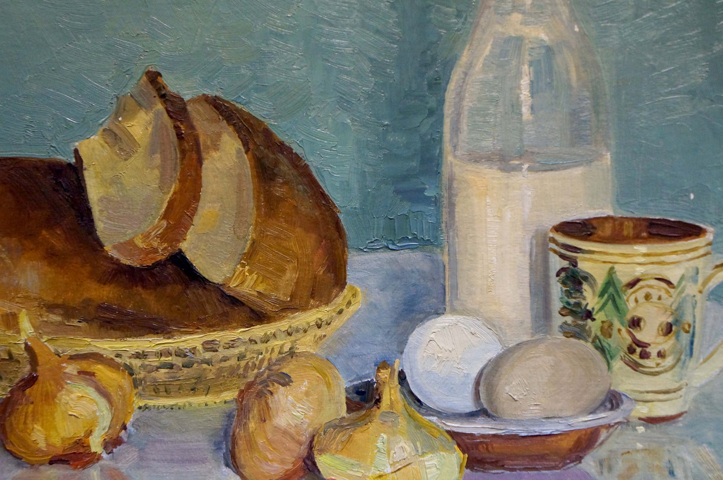 Oil painting of rustic ceramic mug with floral patterns on table