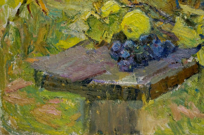 A cluster of dark purple grapes rests on a rustic wooden table, painted with expressive brushstrokes in an impressionistic style.