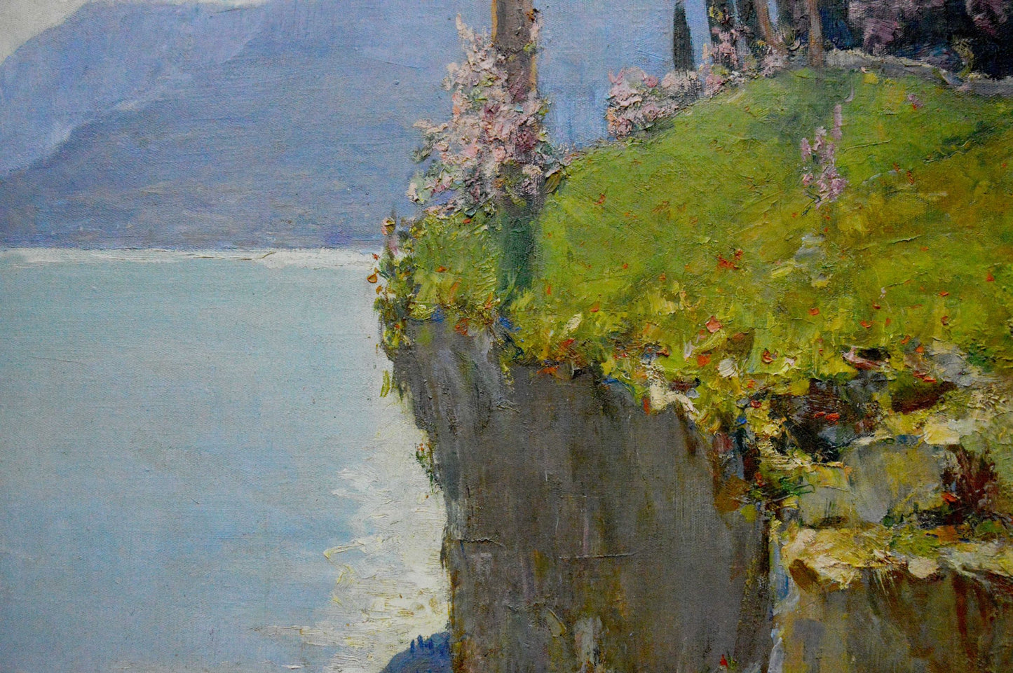 Oil painting On the Mountain by Ivan Alekseevich Vladimirov: green cliffside with pink blossoms by blue lake