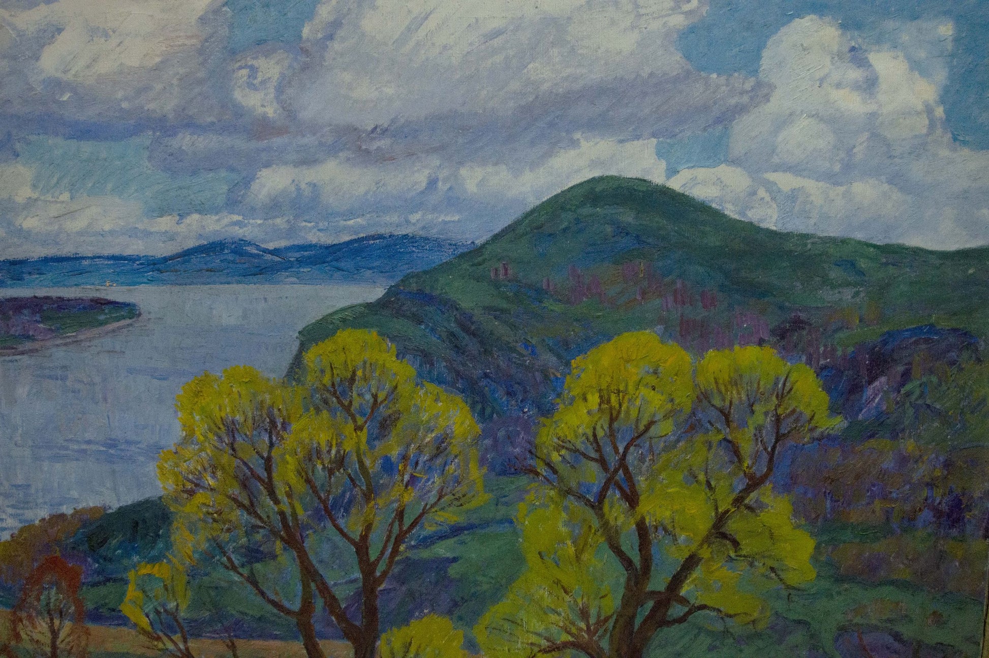 Vibrant oil painting by Koshevoi Stepan Lvovich: lush green hillside, yellow trees, river, cloudy sky