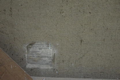 Back of Vladimir Kozyuk oil painting Near the shore with faded beige canvas and worn label