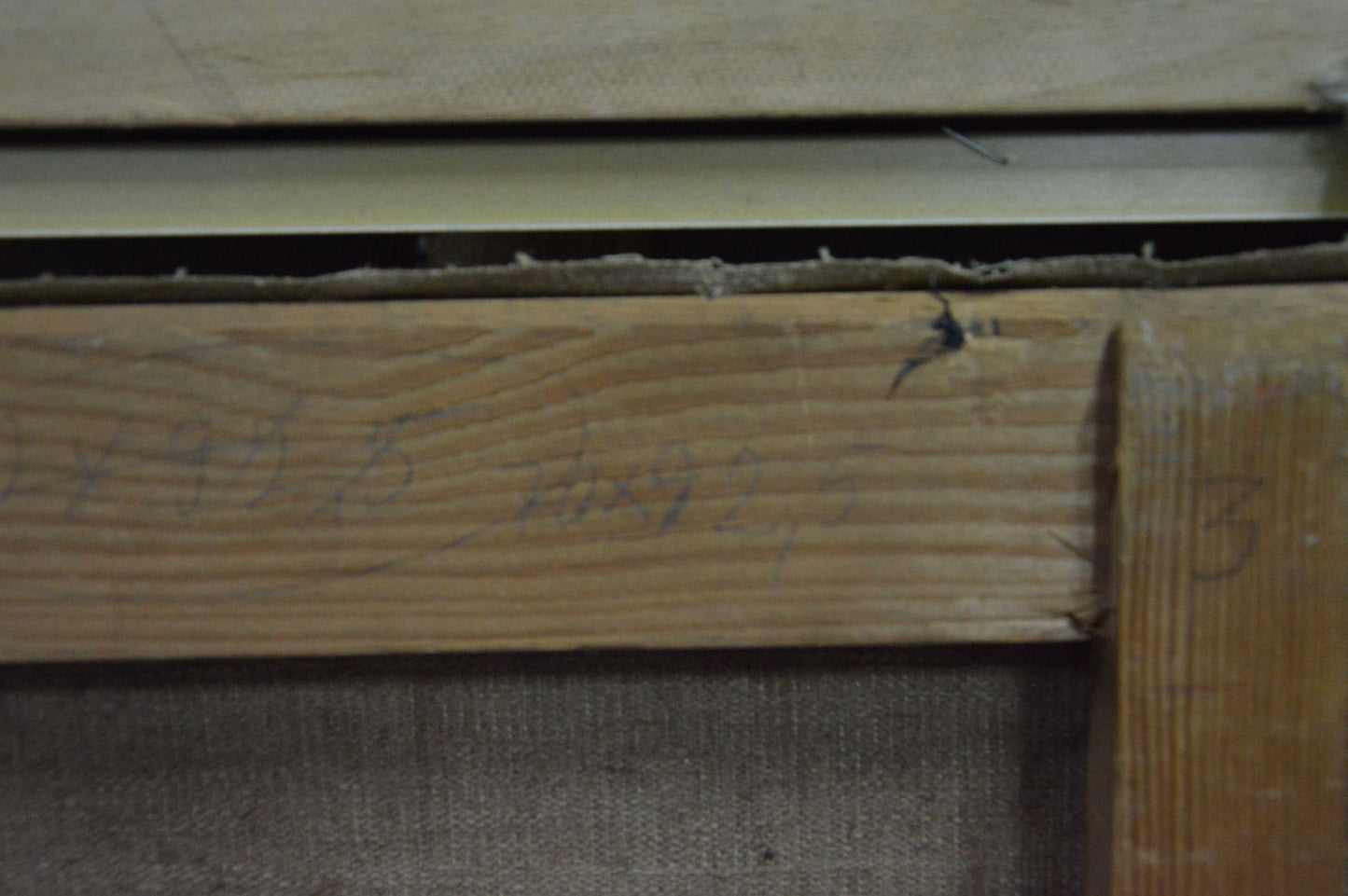 Back of Chegodar Vasily Dmitrievich oil painting: weathered wooden beam with grain, handwritten numbers, nail