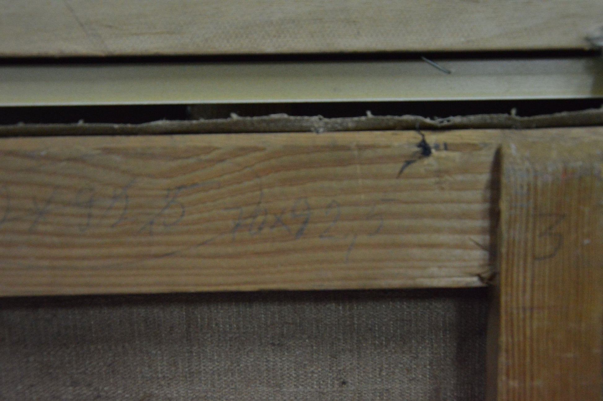 Back of Chegodar Vasily Dmitrievich oil painting: weathered wooden beam with grain, handwritten numbers, nail