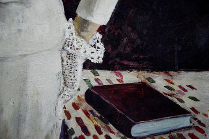 Oil painting of woman portrait by Vladimir Shkatelov in dark red leather book on tablecloth