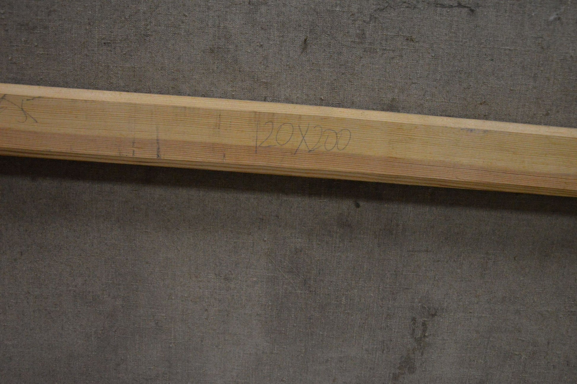 Light wooden beam with engraved markings on Oil painting Walk through the woods