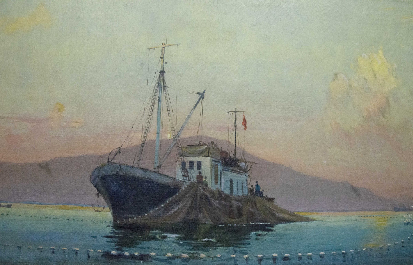 Oil painting by Peter Kuzmich Stolyarenko: dark fishing boat moored by rocky shore at twilight