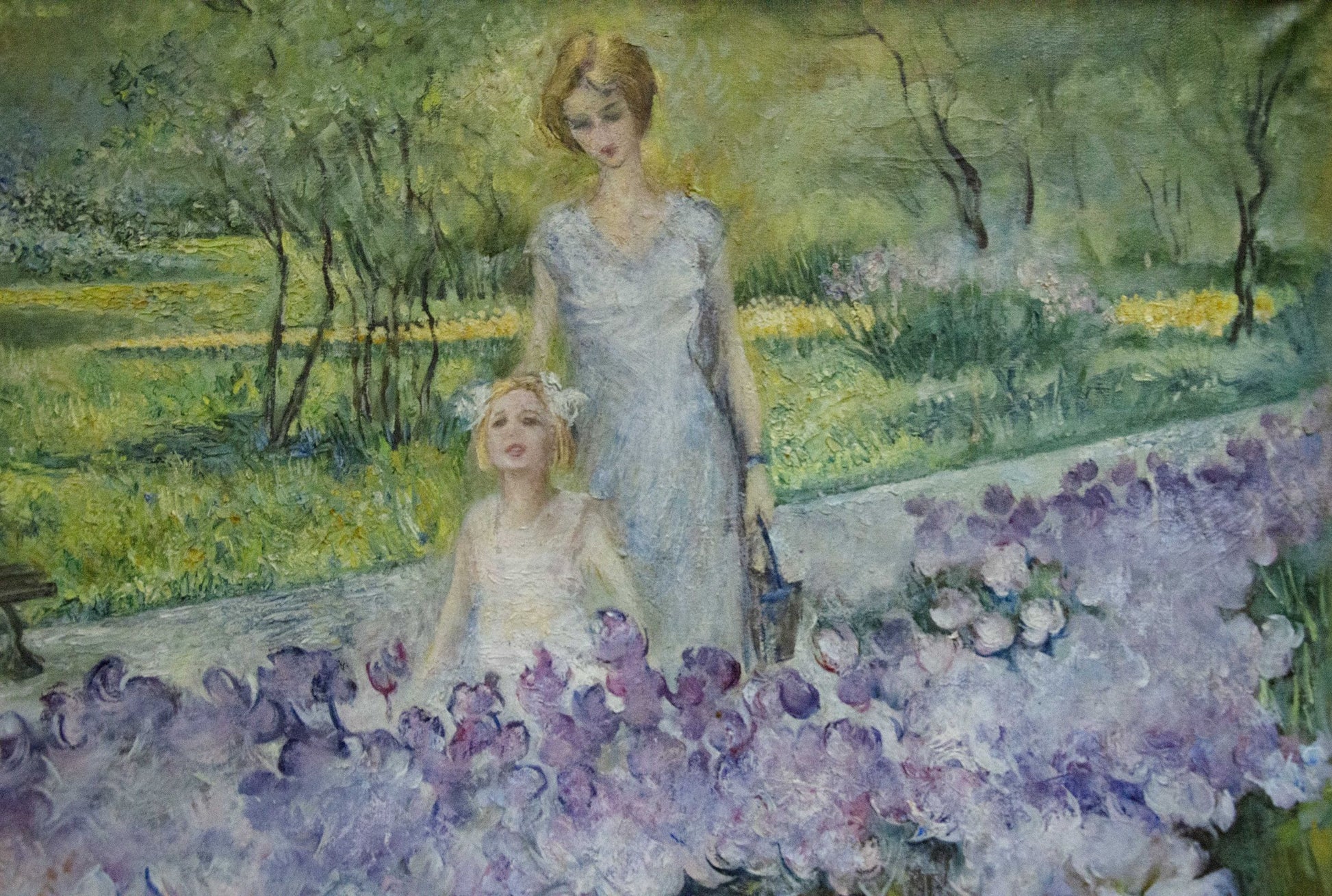 Impressionistic oil painting by Antonchik Viktor Mikhailovich: woman in blue dress, girl in white gown amid purple flowers under peaceful sky